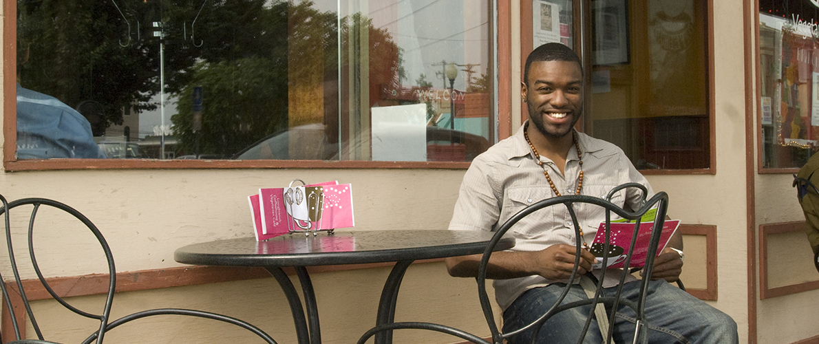 SIU Student reading outside