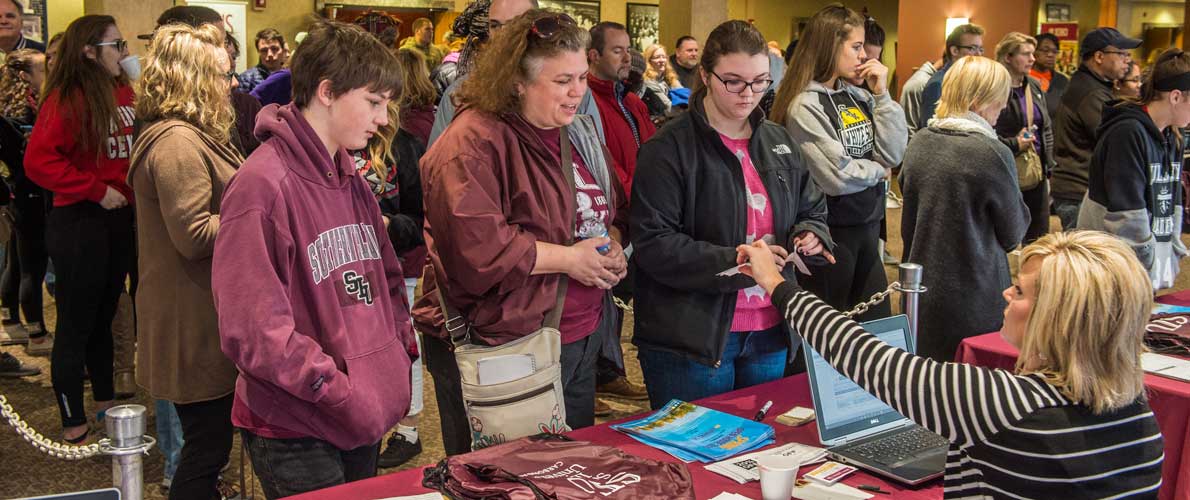 Parents and students at sign in