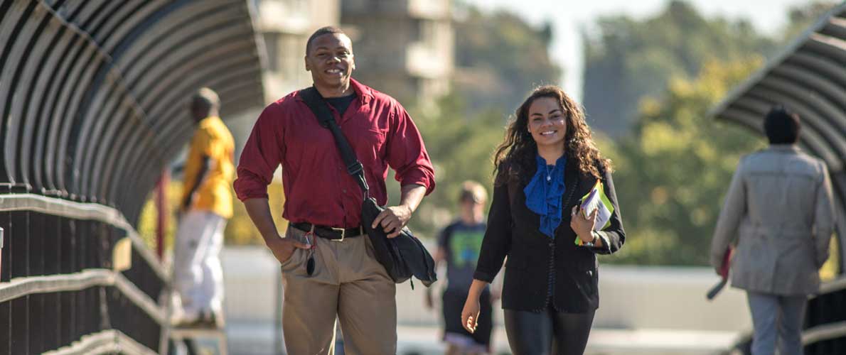 SIU students walking across bridge