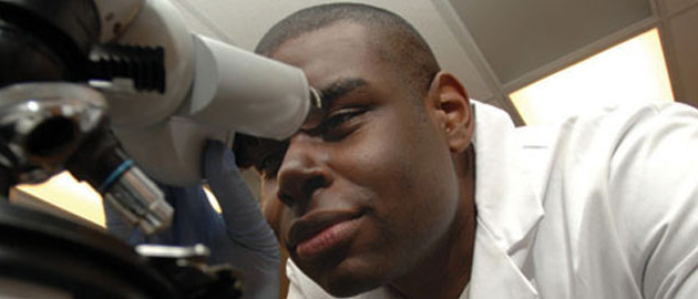 Student using microscope