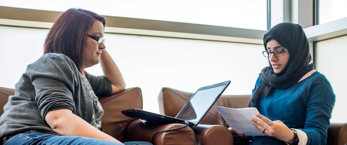 Two women working on an assignment