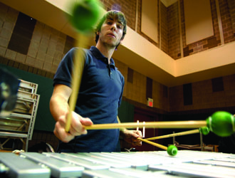 student playing drums