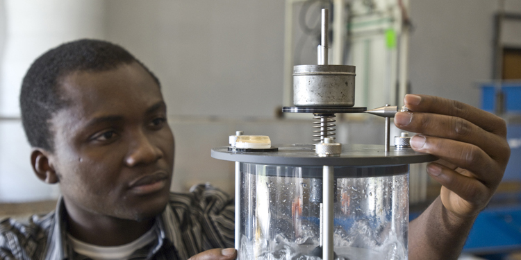 SIU Student Worker Using Lab Equipment